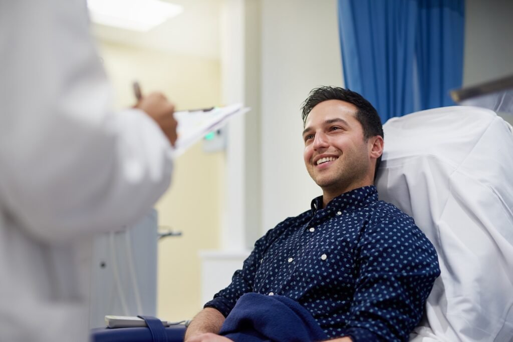 A patient smiling at a doctor